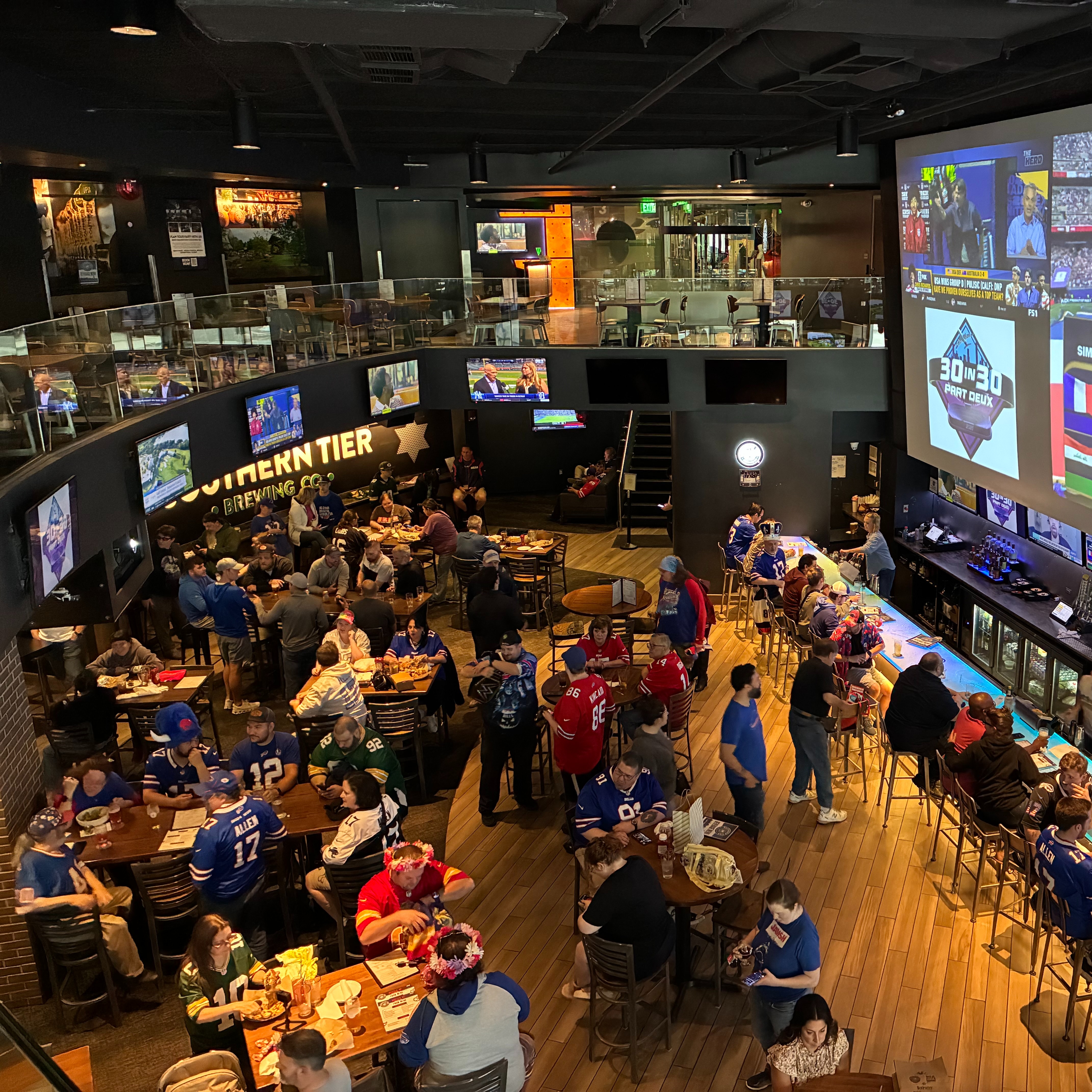 Bills and NFL fans at Tom Grossi's fan event at Southern Tier Brewing in Downtown Buffalo as part of his 30-in-30 tour to fundraise money for St. Jude Children's Research Hospital episode artwork