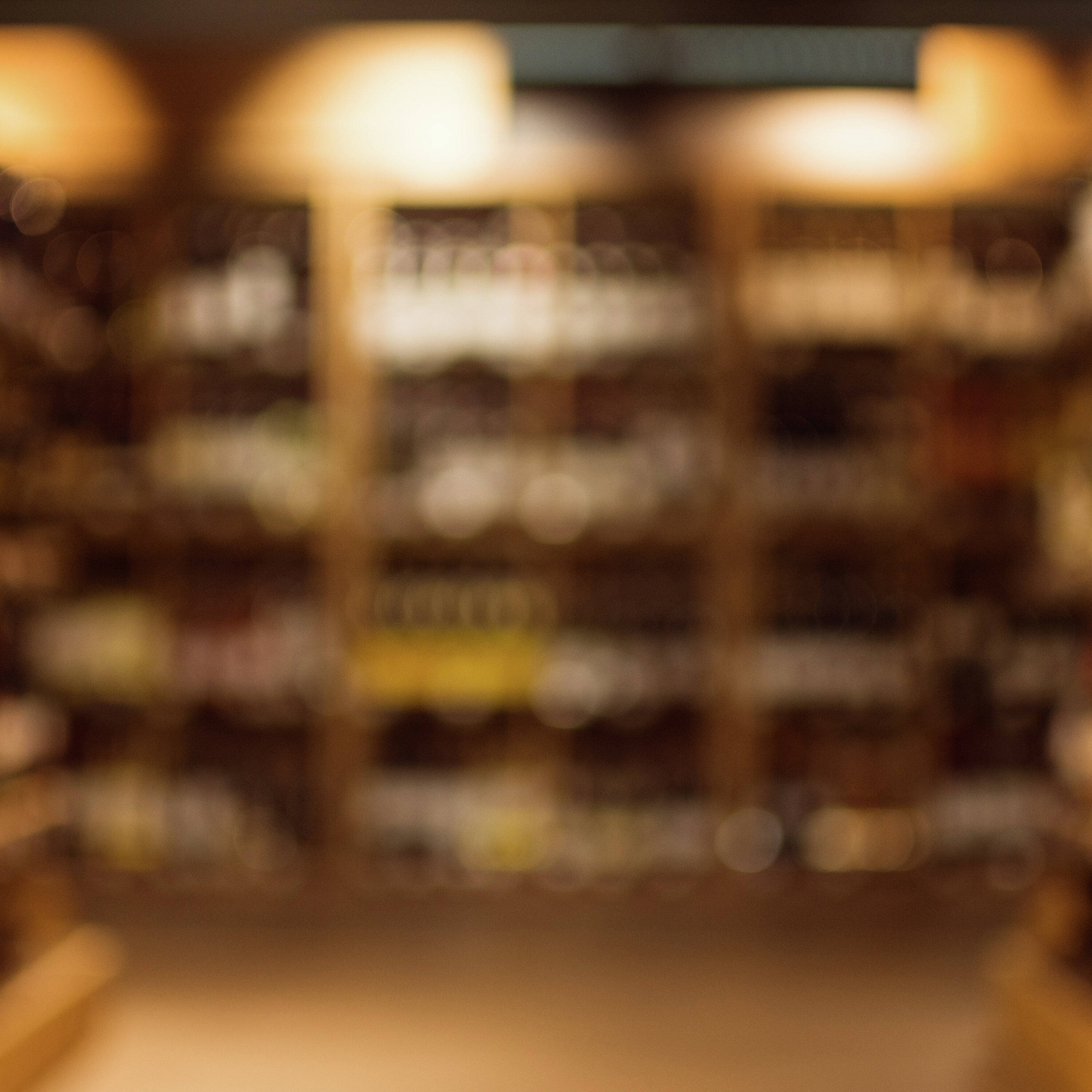 Employee shot and killed at suburban liquor store