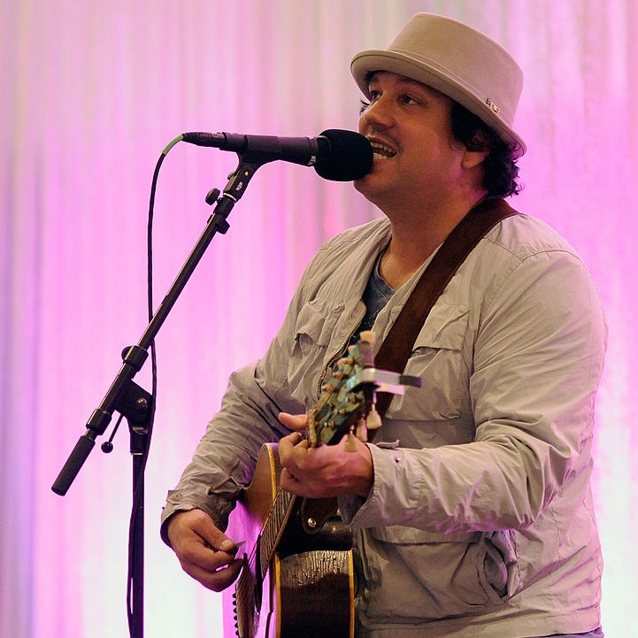 Tim Mahoney is getting ready to play guitar and sing between the rain drops at Target Field. episode artwork
