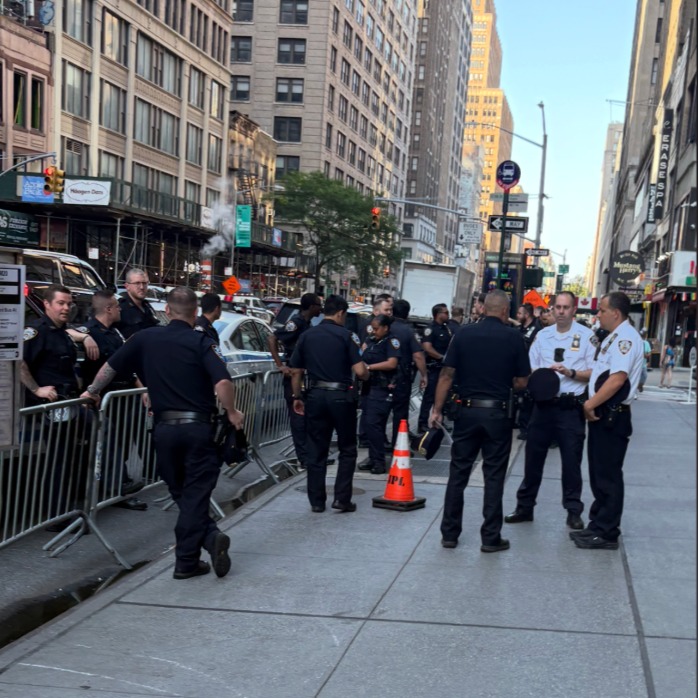 Crowds gather at Madison Square Garden to catch any glimpse of the rumored Swift-Kelce wedding episode artwork