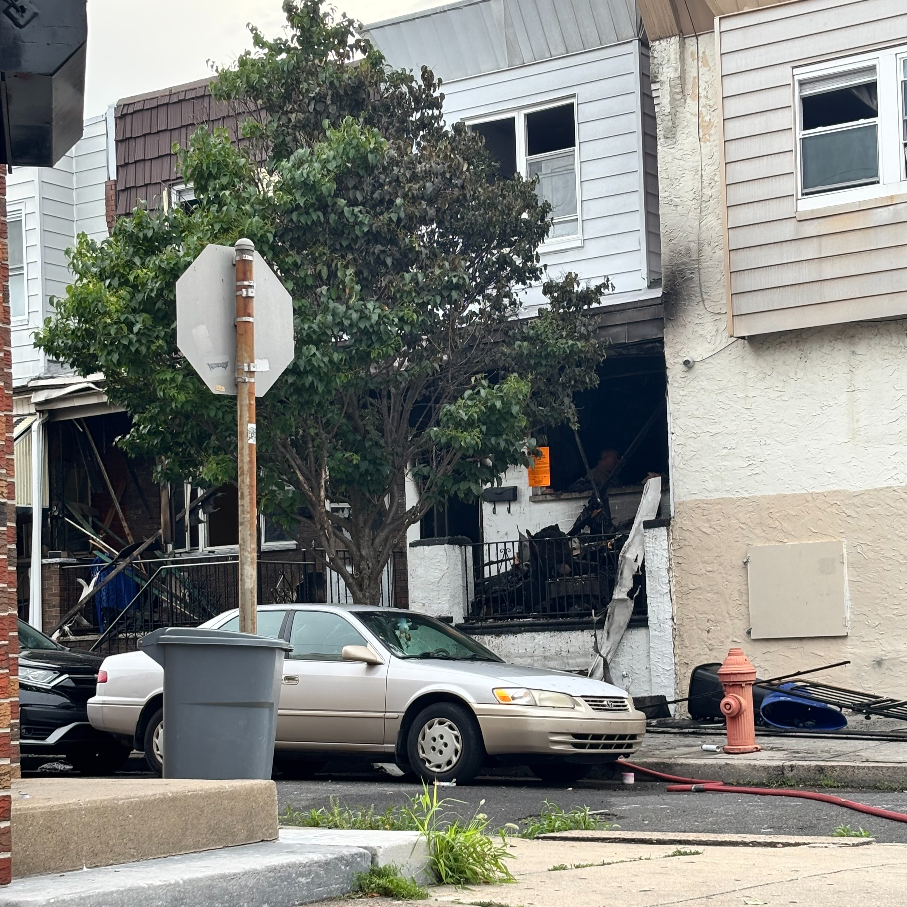 Woman killed, child injured in South Philadelphia row home fire episode artwork