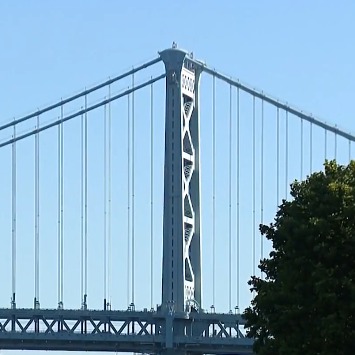 Thousands crowd Ben Franklin Bridge in celebration of its 100th birthday episode artwork