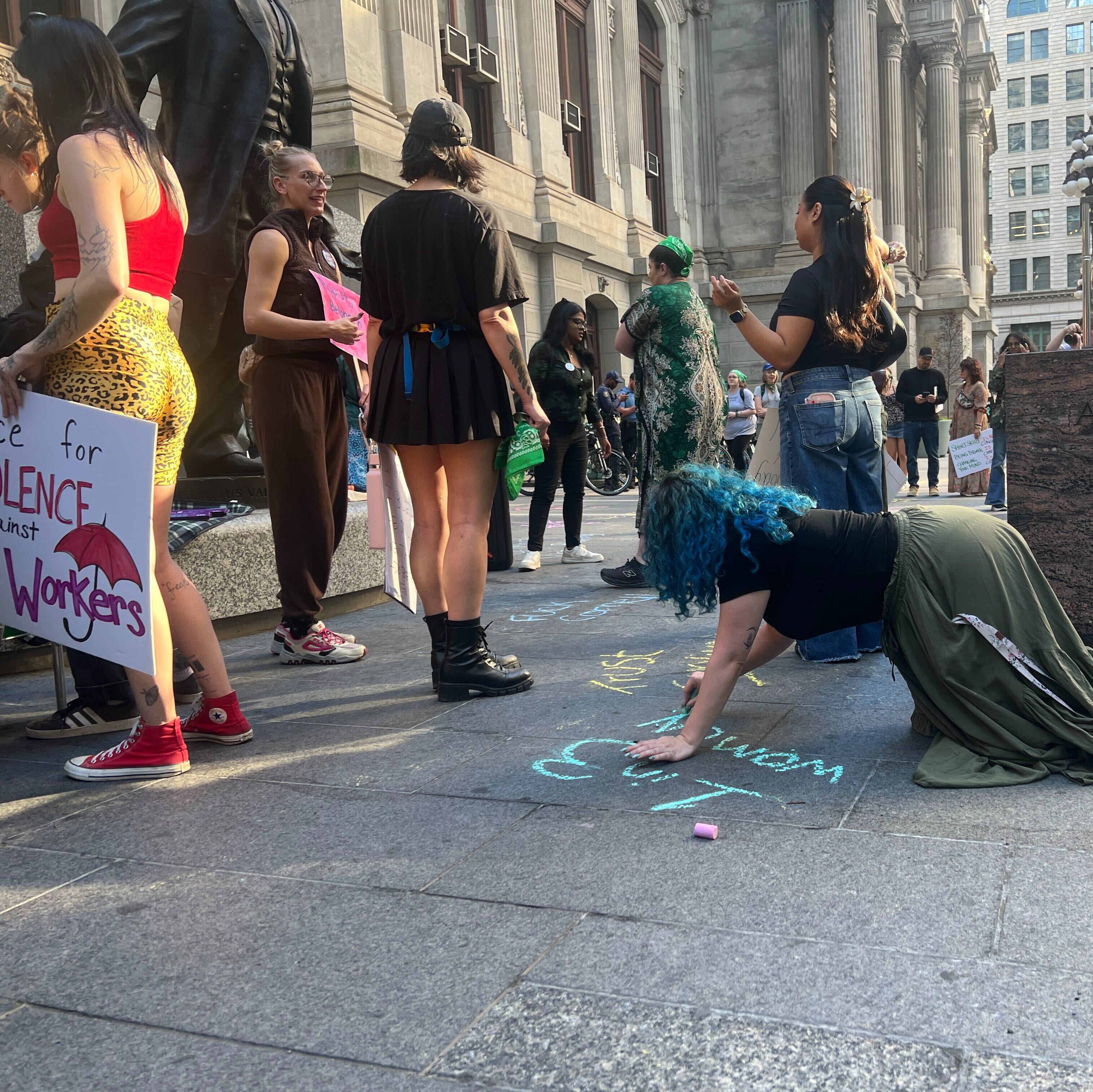 Dozens rally outside City Hall, demanding more from colleges to address sexual assault on campus episode artwork