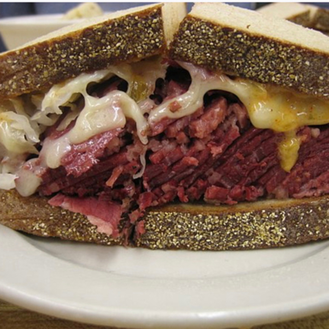 Reuben Sandwich is a North American grilled sandwich composed of Corned Beef,Swiss Cheese,Sauerkraut episode artwork